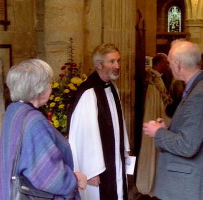 The Rev'd Peter Paine following his licensing.  The Bishop of Repton can be seen in the background.