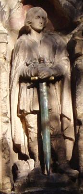 The statue of St Wystan above the church porch.  His sword was donated by Pamela Carr in 2003 in memory of her husband, Douglas, who died in 1991. Douglas was a major in The Royal Berkshire Regiment and saw active service in Malaya. When he left the army he became Secretary of Derbyshire County Cricket Club. He was much involved in the life of the village and served on the Church Council.